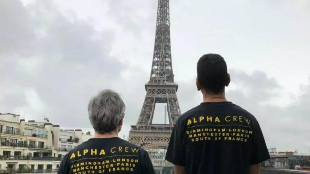 event staff france looking at eiffel tower